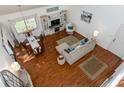 Bright living room featuring hardwood floors, comfortable furniture, and plenty of natural light at 2722 Sand Hollow Ct # 2722, Clearwater, FL 33761