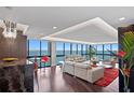 Living room with floor to ceiling windows overlooking the water and a sleek modern design at 3301 Bayshore Blvd # 2207B, Tampa, FL 33629