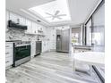 Bright kitchen with stainless steel appliances, white cabinets, and modern countertops at 4137 Northmeadow Cir, Tampa, FL 33618