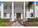A beautiful entrance way featuring stately columns and a new front door at 4935 W Bay Way Pl, Tampa, FL 33629