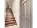 View of the stairs leading up to the unit, featuring solid wood treads at 5636 Baywater Dr # 5636, Tampa, FL 33615