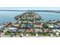 Desirable waterfront property with mature tropical landscaping and easy access to the bay and area beaches at 6129 Leeland S St, St Petersburg, FL 33715
