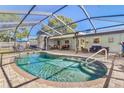 Inviting screened-in pool area with ample seating, perfect for outdoor entertaining and relaxation at 1560 Simmons Dr, Clearwater, FL 33756