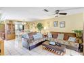 Bright living room with tile flooring, comfortable seating, and an open floor plan at 2811 S Pines Dr # 15, Largo, FL 33771