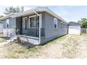 Cozy front porch with decorative railings adds character to this charming home at 3253 57Th N Ave, St Petersburg, FL 33714
