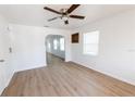 Bright, open living room with wood floors, ceiling fan, and an inviting atmosphere at 3253 57Th N Ave, St Petersburg, FL 33714