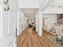 Elegant home foyer with gleaming hardwood floors and sophisticated wainscoting at 3311 Home Ct, Tampa, FL 33611