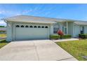 Well-maintained home with a two-car garage, manicured landscaping and a concrete driveway at 4301 Avanti Cir, New Port Richey, FL 34655