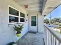 Cozy condominium entrance with an outdoor view and simple decor, offering a private and welcoming entry at 5227 81St Lane N # 26, St Petersburg, FL 33709