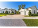 Charming single-Gathering home with manicured landscaping and a three car garage at 5903 Nature Ridge Ln, Lithia, FL 33547