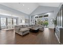 Bright open living room with high ceilings, hardwood floors, and lots of natural light at 5903 Nature Ridge Ln, Lithia, FL 33547