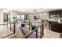 Open-concept living area with tile flooring, modern furnishings, and golf course views at 706 S Davis Blvd, Tampa, FL 33606