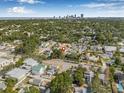 Stunning aerial view of the neighborhood showcasing the lush greenery and distant cityscape at 718 30Th N Ave, St Petersburg, FL 33704