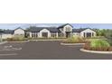 Beautifully landscaped community center with ample parking and attractive architectural design at 9759 Crescent Moon Dr, Riverview, FL 33578
