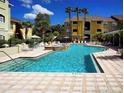 Enjoy this beautiful community pool and sundeck on sunny day in a lush tropical setting at 1240 S Missouri Ave # 415, Clearwater, FL 33756