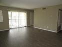 Open-plan living area boasts modern floors and neutral paint scheme at 13289 Arbor Pointe Cir # 201, Tampa, FL 33617