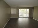 Spacious living room featuring sleek wood floors and abundant natural light at 13289 Arbor Pointe Cir # 201, Tampa, FL 33617