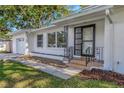Up close front view with a well-manicured lawn and a charming front entrance at 1432 S Keene Rd, Clearwater, FL 33756