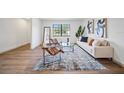 Inviting living room with hardwood floors, contemporary decor, and plenty of natural light at 17815 Cranbrook Dr, Lutz, FL 33549