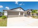 Charming single-Gathering home featuring an attached two-car garage and well-kept lawn at 1873 Colding Dr, Ruskin, FL 33570