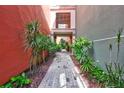 Charming walkway featuring lush landscaping, plants, and a brick path that creates a serene ambiance at 2411 W Horatio St # 526, Tampa, FL 33609