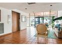 Comfortable lobby area with neutral tones, tile flooring, and seating near elevator at 2593 Countryside Blvd # 7204, Clearwater, FL 33761