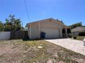 The exterior of the home showcases a two-car garage, with additional parking on the brick driveway at 4363 Elwood Rd, Spring Hill, FL 34609
