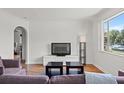 Open-concept living room with hardwood floors, perfect for entertaining guests at 4400 2Nd S Ave, St Petersburg, FL 33711