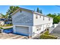 Exterior home elevation with a garage, showcasing functionality and potential for renovation to enhance curb appeal at 4610 47Th N Way, St Petersburg, FL 33702