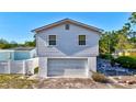 Charming exterior with garage on a bright day, offering practicality and potential for customization at 4610 47Th N Way, St Petersburg, FL 33702