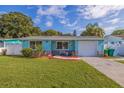 Lovely single-story home with a manicured lawn and cozy front porch at 6219 57Th N Ave, St Petersburg, FL 33709