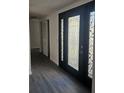 Inviting entryway with sleek flooring and decorative glass front door at 6241 Westport Dr, Port Richey, FL 34668