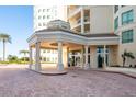 The entrance to the building features a brick drive and covered entrance with columns at 1170 Gulf Blvd # 402, Clearwater, FL 33767
