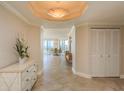 The residence's foyer features tile flooring, decorative lighting, and closet storage at 1170 Gulf Blvd # 402, Clearwater, FL 33767