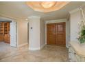 The residence's foyer features a double-door entry and decorative lighting at 1170 Gulf Blvd # 402, Clearwater, FL 33767
