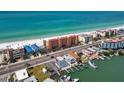 An aerial view showcases the coastal condo's prime location, steps away from the beach, shops, and restaurants at 13720 Gulf Blvd # 305, Madeira Beach, FL 33708