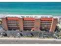 A full exterior view highlights the condo building and amenities, including easy beach access and parking at 13720 Gulf Blvd # 305, Madeira Beach, FL 33708