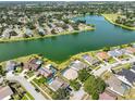 A beautiful aerial view of the neighborhood and the lake behind many of the homes at 1604 Storington Ave, Brandon, FL 33511