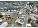 Overhead view of home in a tranquil neighborhood near the lake, indicated by a pin at 1809 Haverford Ave, Sun City Center, FL 33573