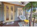 Charming screened-in porch with comfortable seating, a ceiling fan, and tropical accents at 2121 Dartmouth N Ave, St Petersburg, FL 33713