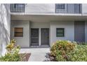Exterior entrance to units with plants and walkway at 2650 Countryside Blvd # A104, Clearwater, FL 33761