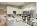 Bright kitchen featuring stainless steel appliances, granite countertops, tile backsplash, and ample cabinet space, ideal for cooking at 3647 Scarlet Tanager Dr, Palm Harbor, FL 34683
