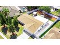 Aerial view of a well-maintained home with a spacious backyard, patio, and lush landscaping at 512 Flamingo Dr, Apollo Beach, FL 33572