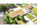 An elevated view showcasing a property with a large, enclosed backyard providing privacy at 512 Flamingo Dr, Apollo Beach, FL 33572