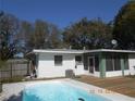Backyard oasis with a sparkling pool, deck, and screened patio perfect for outdoor relaxation and entertaining at 5318 7Th N Ave, St Petersburg, FL 33710