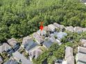 Aerial view of the home located in a community surrounded by lush green trees and well-manicured lawns at 10503 Dotham Ct, Tampa, FL 33626