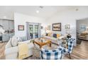 Comfortable living room featuring hardwood floors and stylish furnishings at 12317 Smokey Dr, Hudson, FL 34669