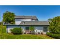 A home with lush landscaping, enhancing curb appeal at 1241 N Mcmullen Booth Rd, Clearwater, FL 33759