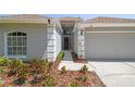 Well-maintained home with manicured landscaping, neutral exterior, and an inviting entrance leading to a bright interior at 1517 Little Brook Ln, Brandon, FL 33511