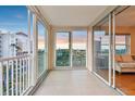 Spacious balcony with sliding glass doors offering natural light and beautiful views of nearby landscaping at 2625 Terra Ceia Bay Blvd # 406, Palmetto, FL 34221